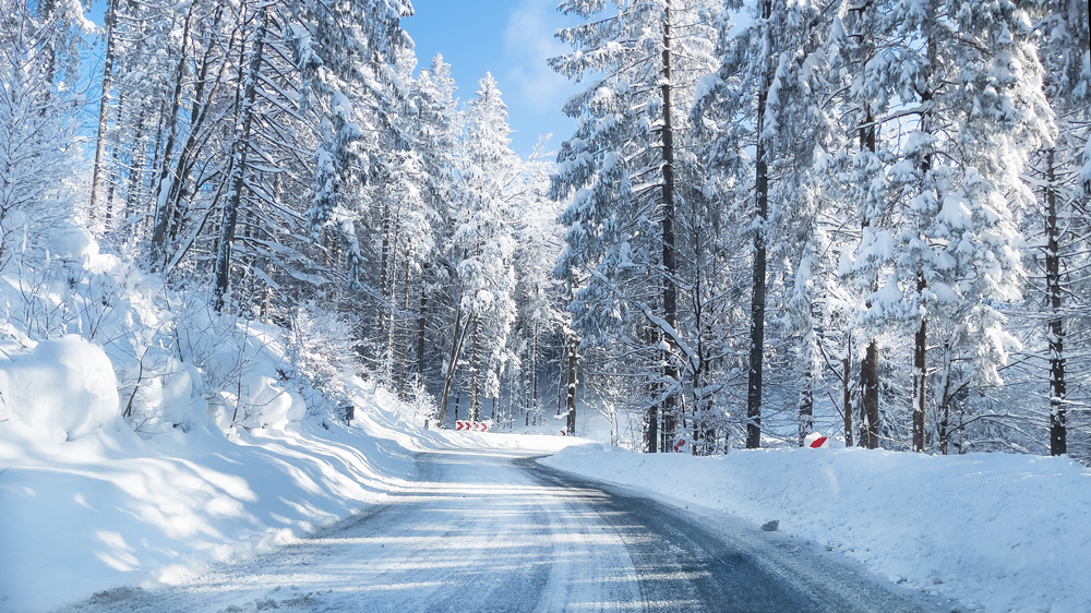A photo of a snowy winter road.