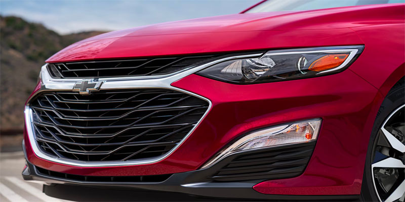 a red 2025 Chevrolet Malibu front end close up